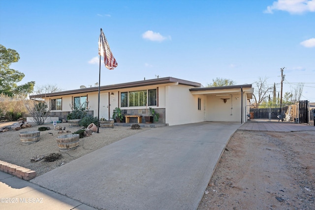 ranch-style house with a carport