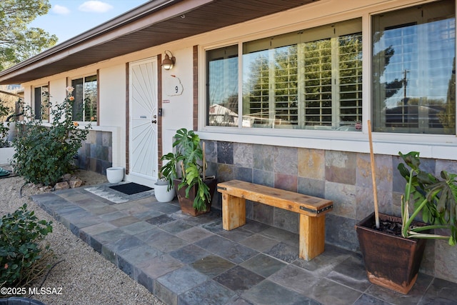 doorway to property with a patio