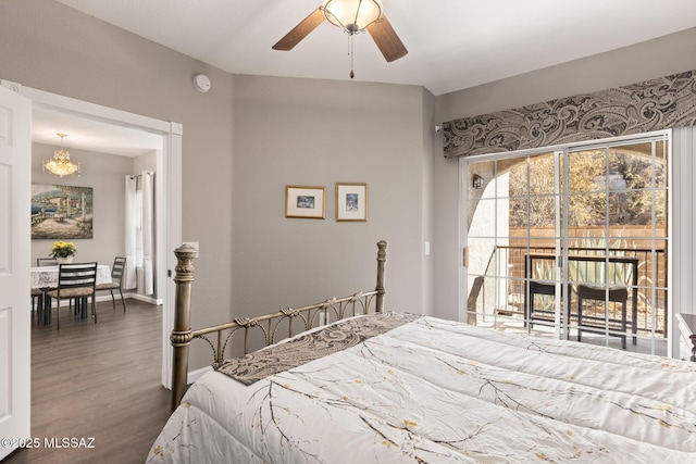 bedroom with access to exterior, ceiling fan with notable chandelier, and hardwood / wood-style flooring