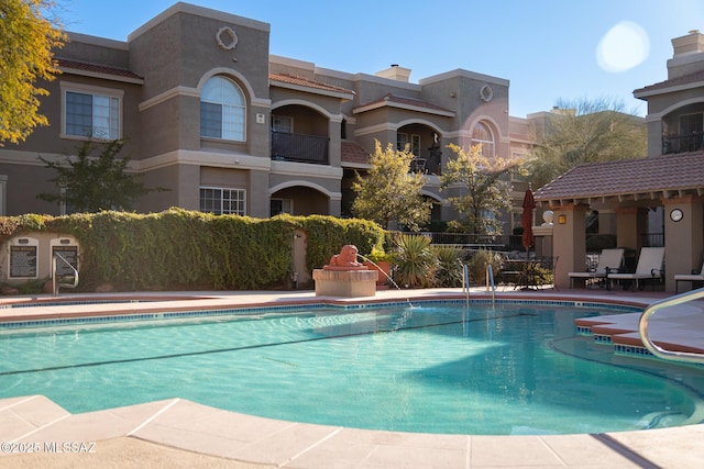 view of pool featuring a patio area