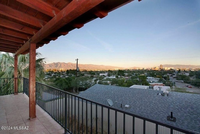 balcony at dusk with a mountain view