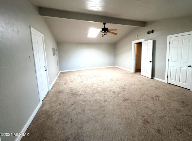 bonus room featuring ceiling fan, vaulted ceiling with beams, and carpet flooring