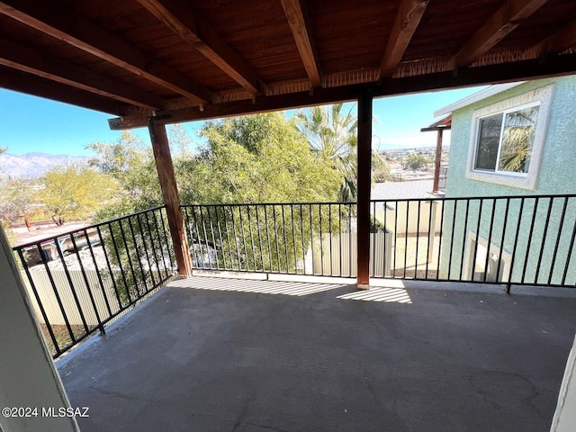 view of patio featuring a balcony