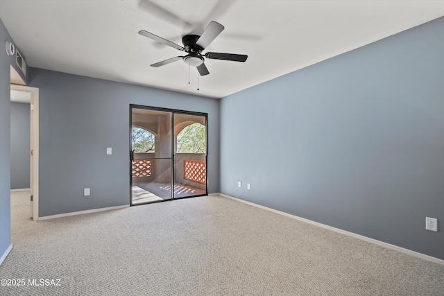 empty room with carpet floors and ceiling fan