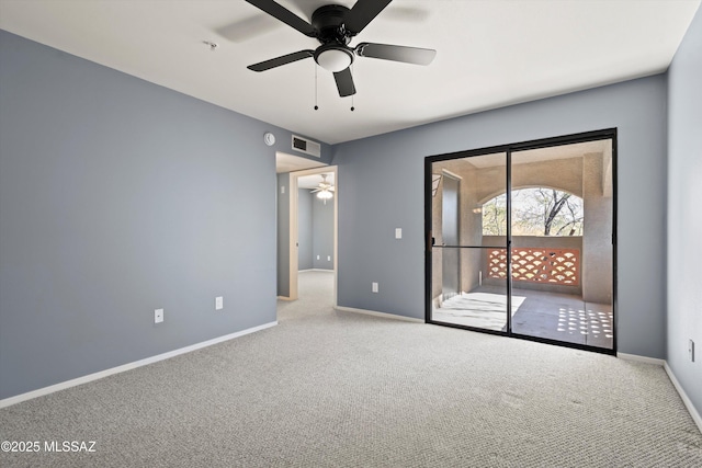 carpeted empty room featuring ceiling fan