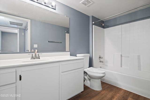 full bathroom with toilet, vanity, shower / bathtub combination, and hardwood / wood-style floors