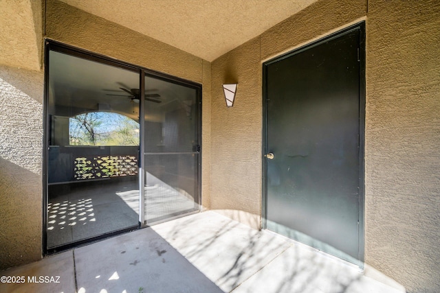 property entrance featuring a patio