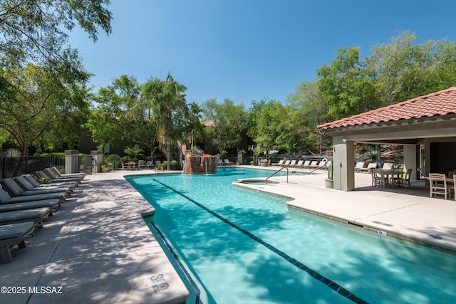 view of pool featuring a patio