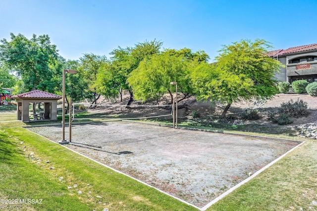 view of community with a lawn, a gazebo, and volleyball court