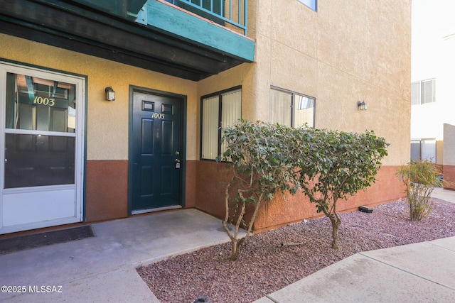 entrance to property with a balcony