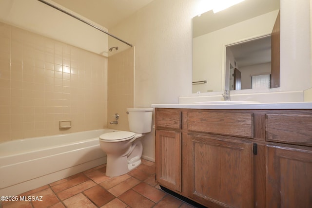 full bathroom with tiled shower / bath, vanity, and toilet