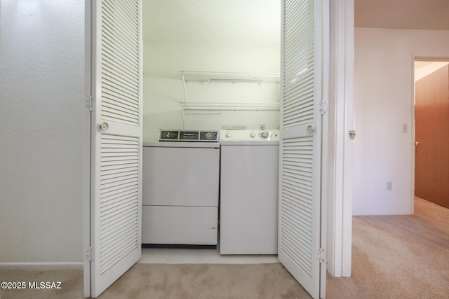 washroom with light colored carpet and independent washer and dryer