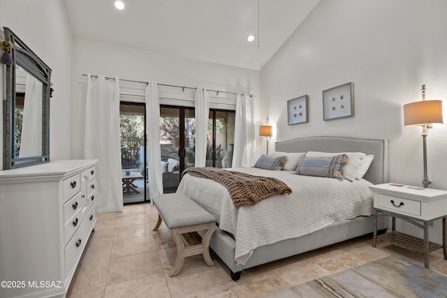 bedroom with access to outside and high vaulted ceiling