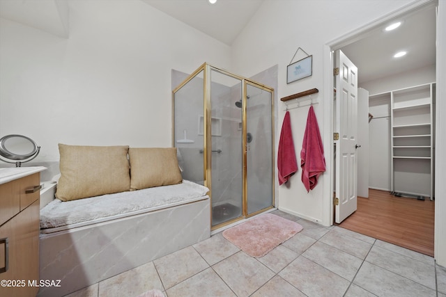 bathroom with tile patterned floors and walk in shower