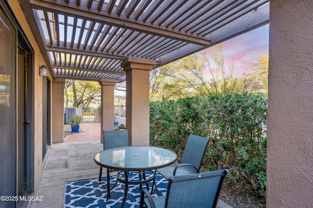 patio terrace at dusk with a pergola