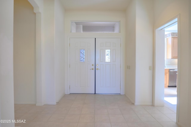 foyer with light tile patterned flooring