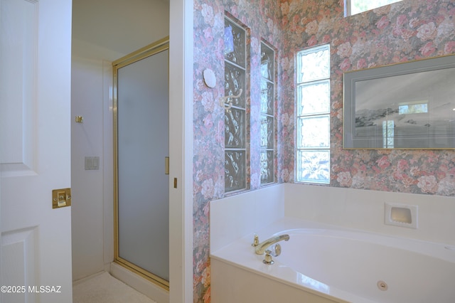 bathroom with a wealth of natural light and shower with separate bathtub