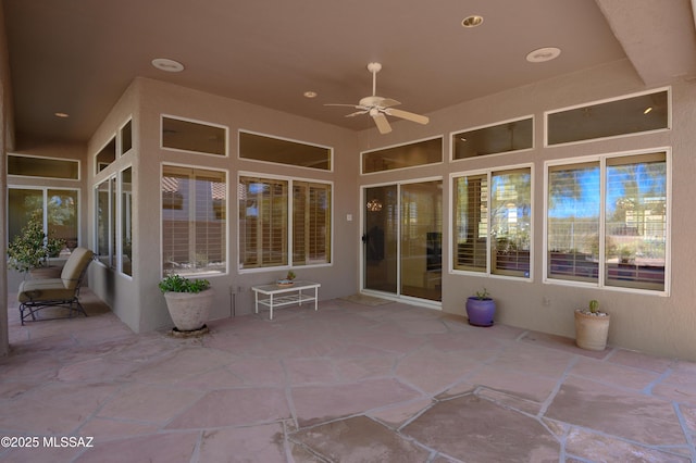 view of patio featuring ceiling fan