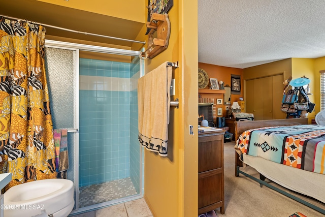 interior space featuring a textured ceiling, walk in shower, and toilet