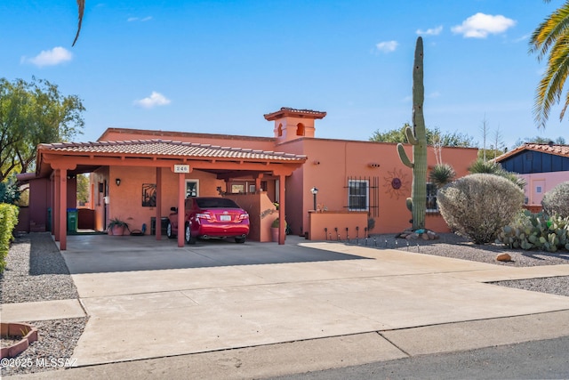 view of front of property with a carport