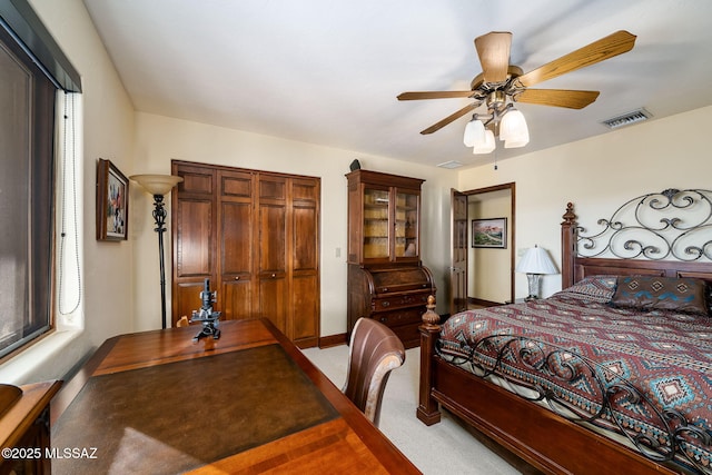 bedroom featuring carpet floors, a closet, and ceiling fan