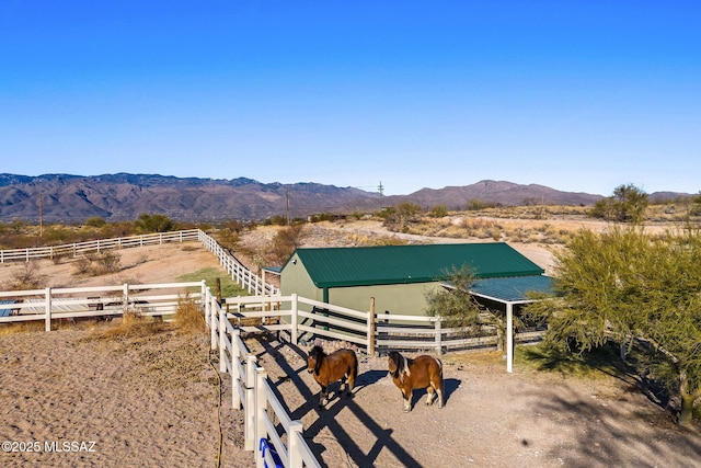 exterior space featuring a rural view and a mountain view