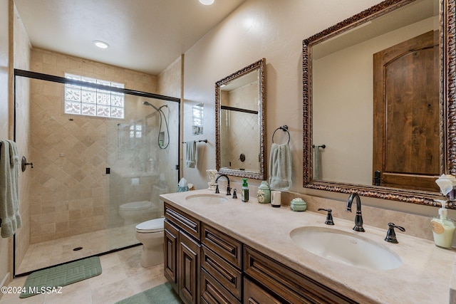 bathroom with toilet, vanity, and walk in shower