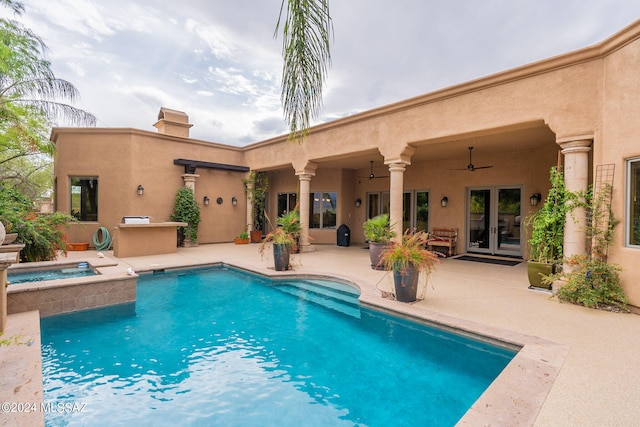 view of swimming pool featuring a patio, ceiling fan, and an in ground hot tub