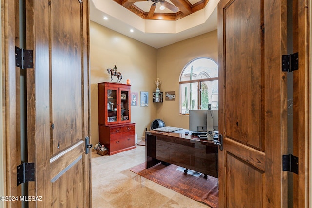 office featuring ceiling fan, ornamental molding, coffered ceiling, and beam ceiling