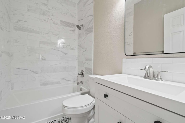 full bathroom with toilet, tiled shower / bath combo, tasteful backsplash, and vanity