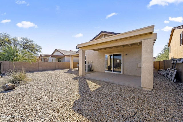 back of house with central AC and a patio area