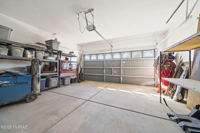 garage featuring a garage door opener