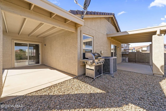 view of patio / terrace with cooling unit and area for grilling