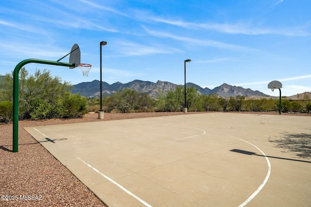 view of sport court with a mountain view