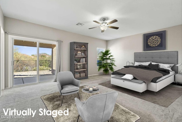 carpeted bedroom featuring access to exterior and ceiling fan