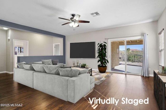 living room featuring ceiling fan and dark hardwood / wood-style flooring