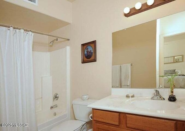 full bathroom with toilet, vanity, and shower / tub combo with curtain