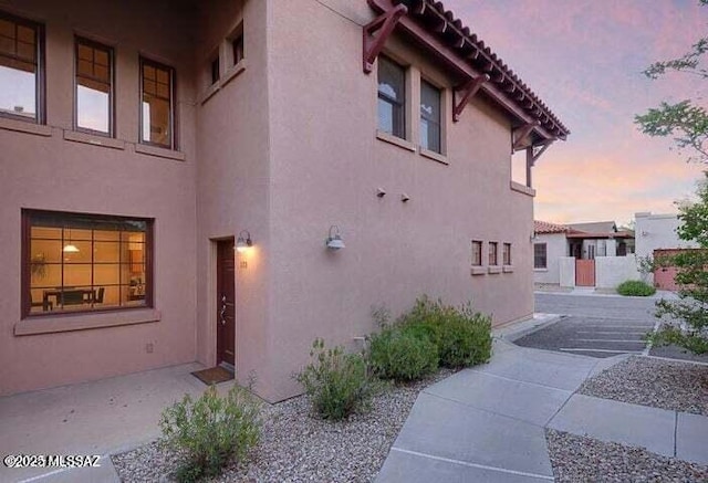 view of property exterior at dusk