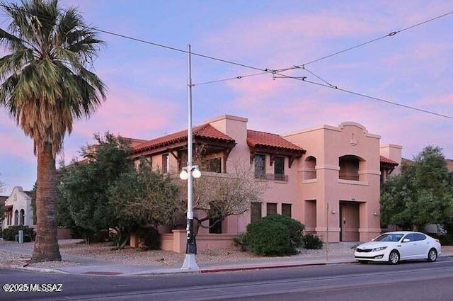 view of outdoor building at dusk