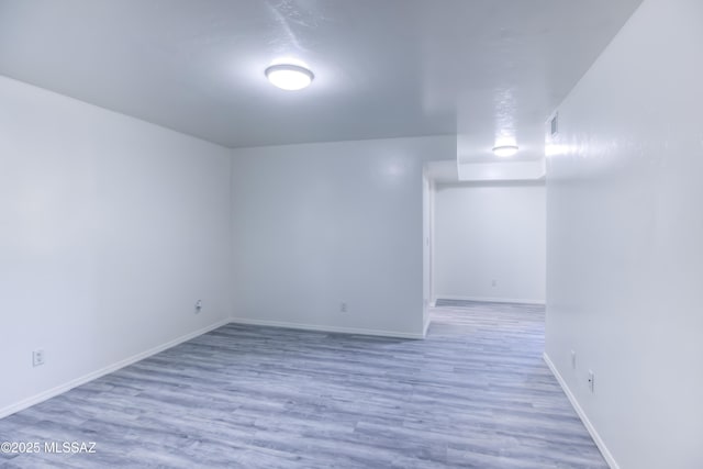 unfurnished room with hardwood / wood-style floors