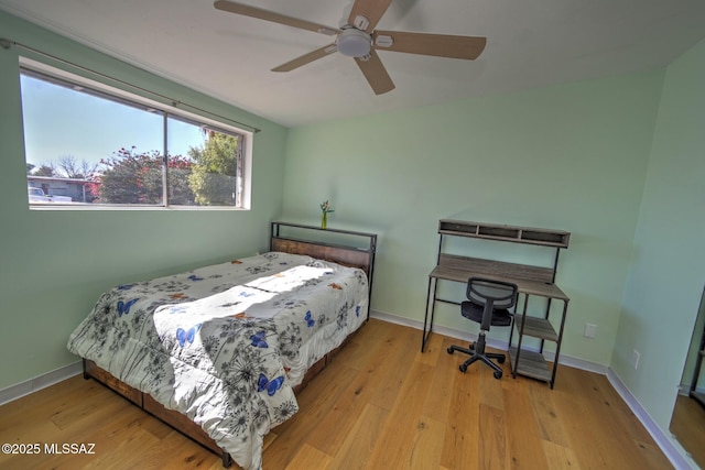 bedroom with ceiling fan and light wood-type flooring