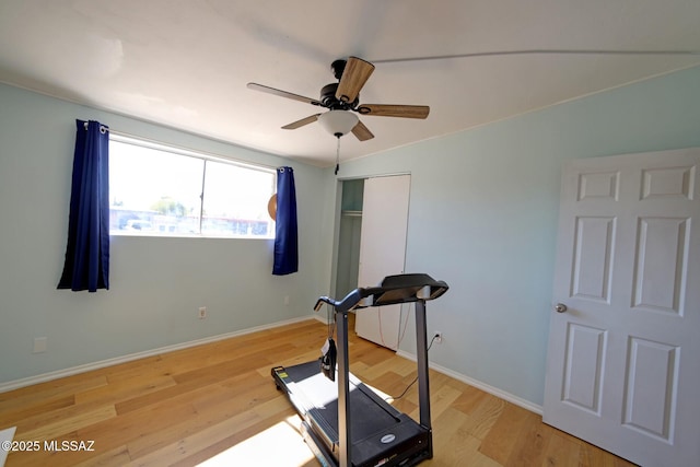 exercise area with ceiling fan and hardwood / wood-style floors