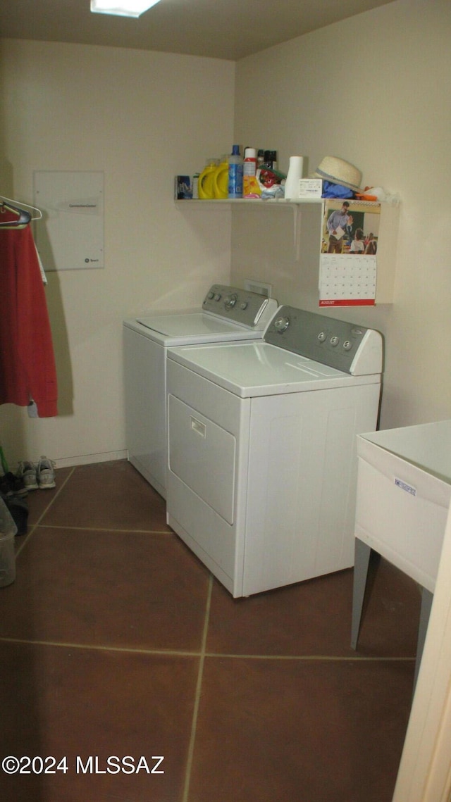 laundry room with separate washer and dryer and sink