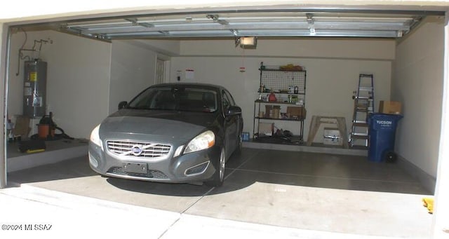 garage featuring a garage door opener and water heater