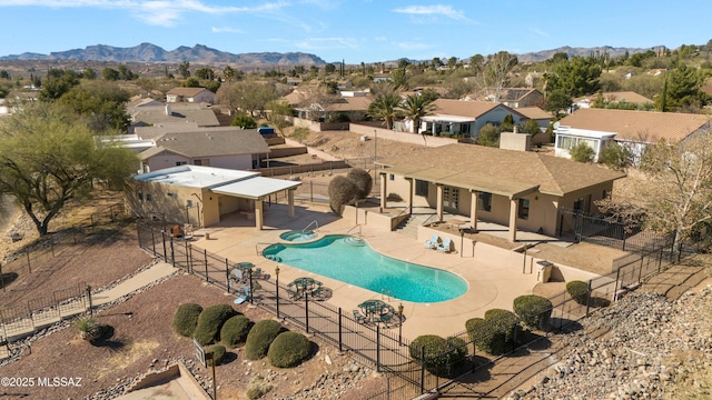 view of swimming pool featuring a mountain view and a patio