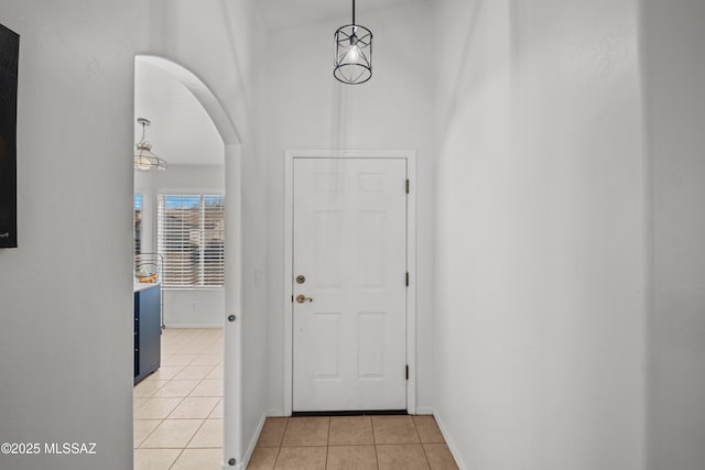 entryway with light tile patterned flooring