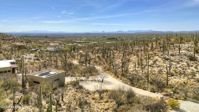 birds eye view of property with a mountain view