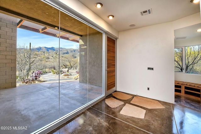 entryway with concrete flooring, visible vents, and a mountain view