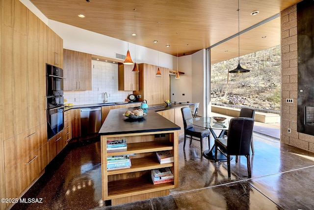 kitchen with dishwasher, hanging light fixtures, dark countertops, and modern cabinets