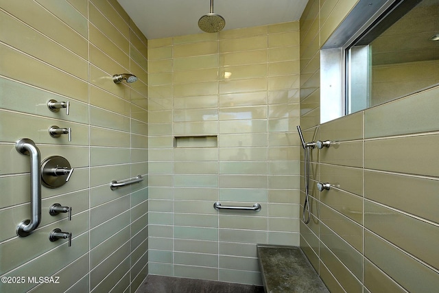 full bath featuring a tile shower